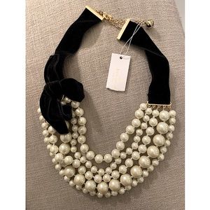 Statement layered pearl and velvet choker necklace with a velvet bow.